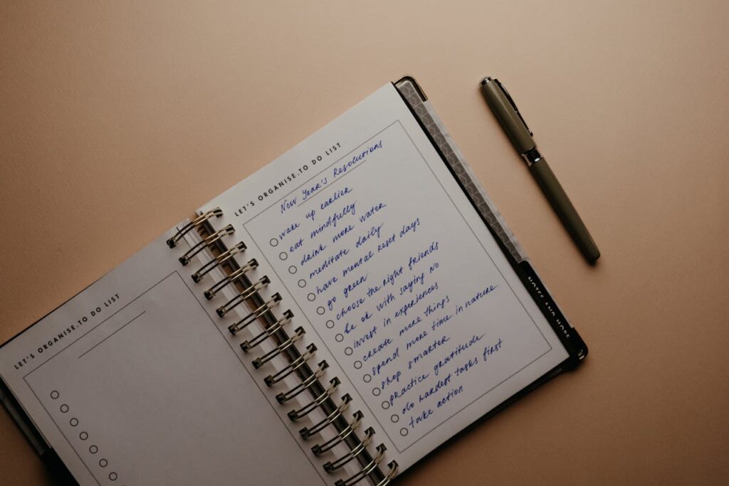 Planner Beside a Pen